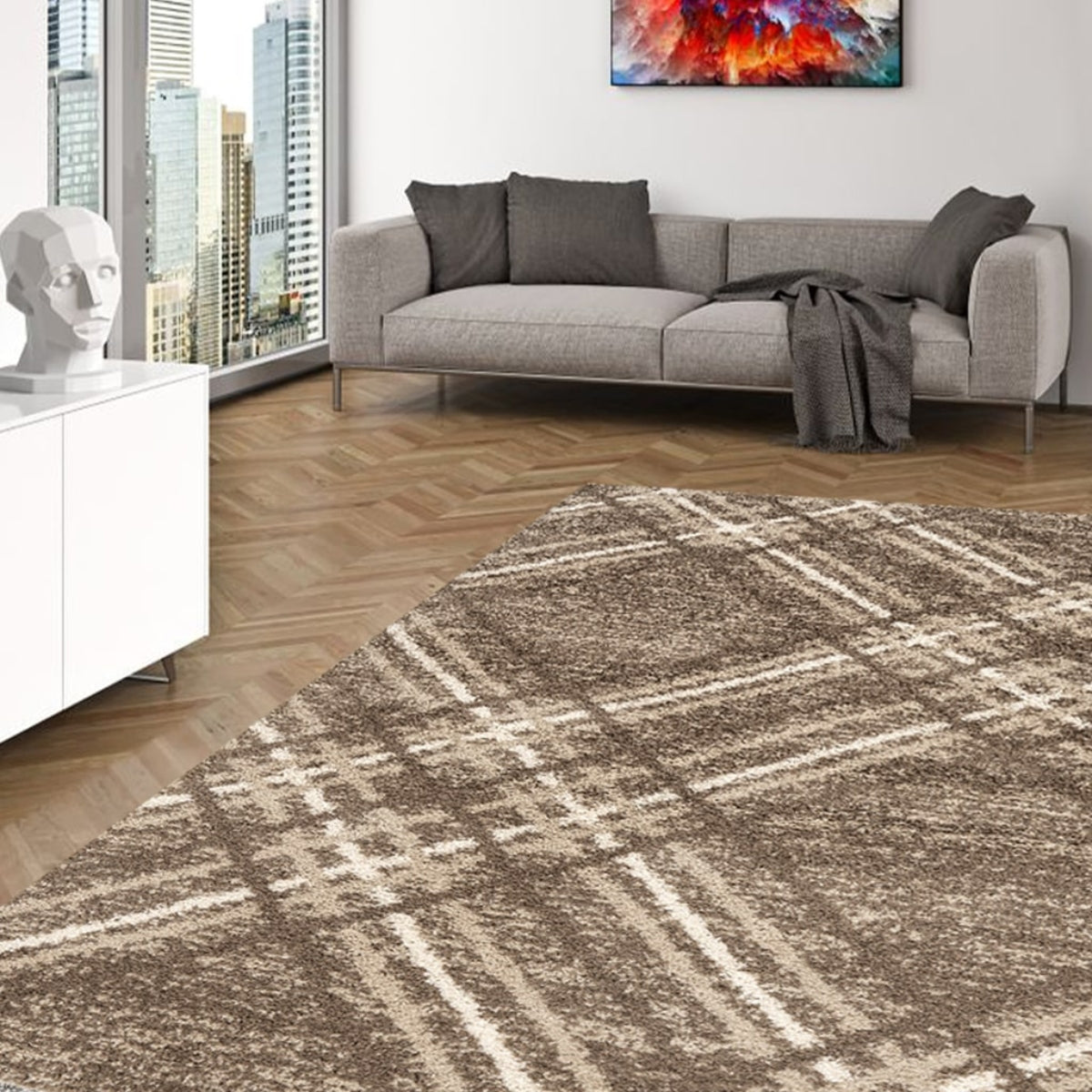 Living room with a plaid patterned rug, gray sofa, and cityscape view.