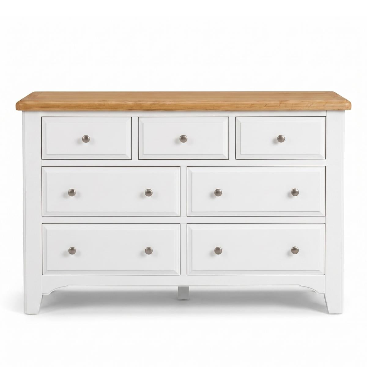 Mimosa white seven-drawer dresser with a natural oak wood top and small round silver knobs, shown against a plain white background.
