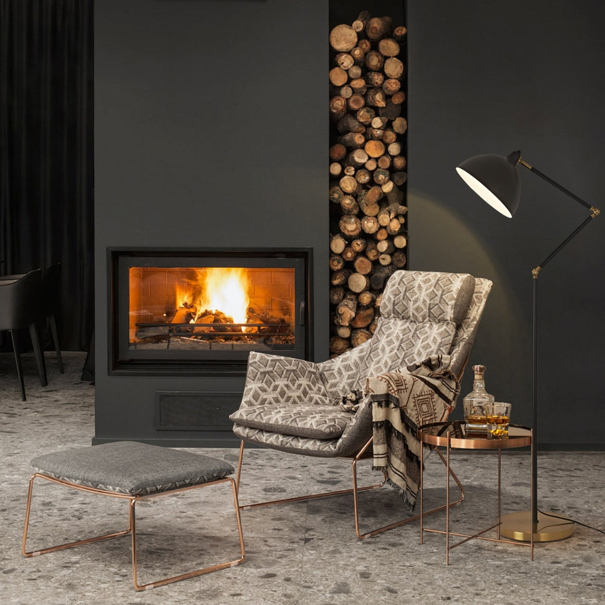 Cozy living room with a fireplace, armchair, and side table.