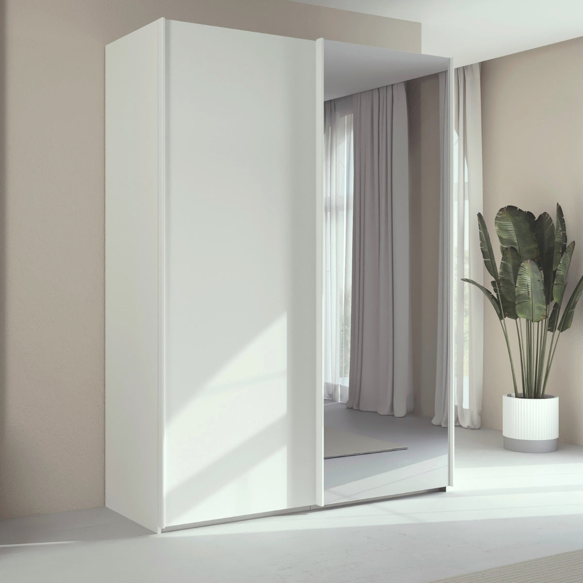 Trixie white wardrobe with a mirror in a room with curtains and a plant.