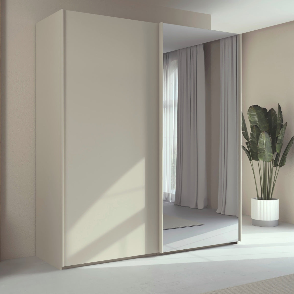 Trixie modern wardrobe with a mirror in a minimalistic room with a plant.