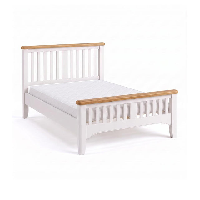 Mimosa wooden bed frame with a white painted finish and natural light oak headboard and footboard rails, shown with a white mattress on a clean white background.