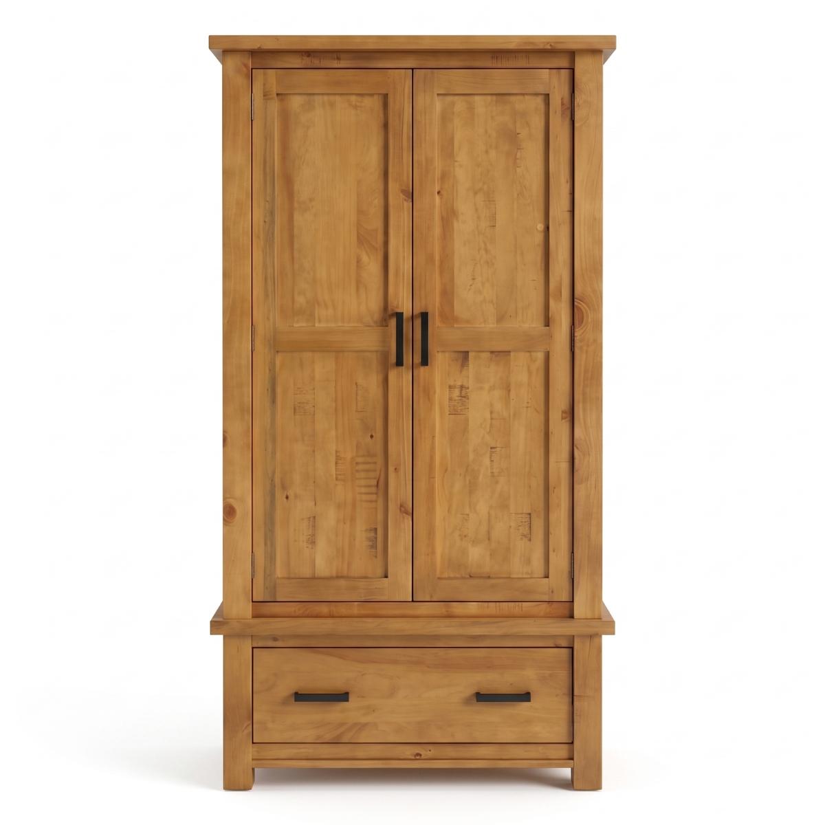 Ailbhe rustic oak two-door wooden wardrobe with a single drawer at the bottom, featuring a warm honey-toned wood finish and black metal handles, shown against a plain white background.