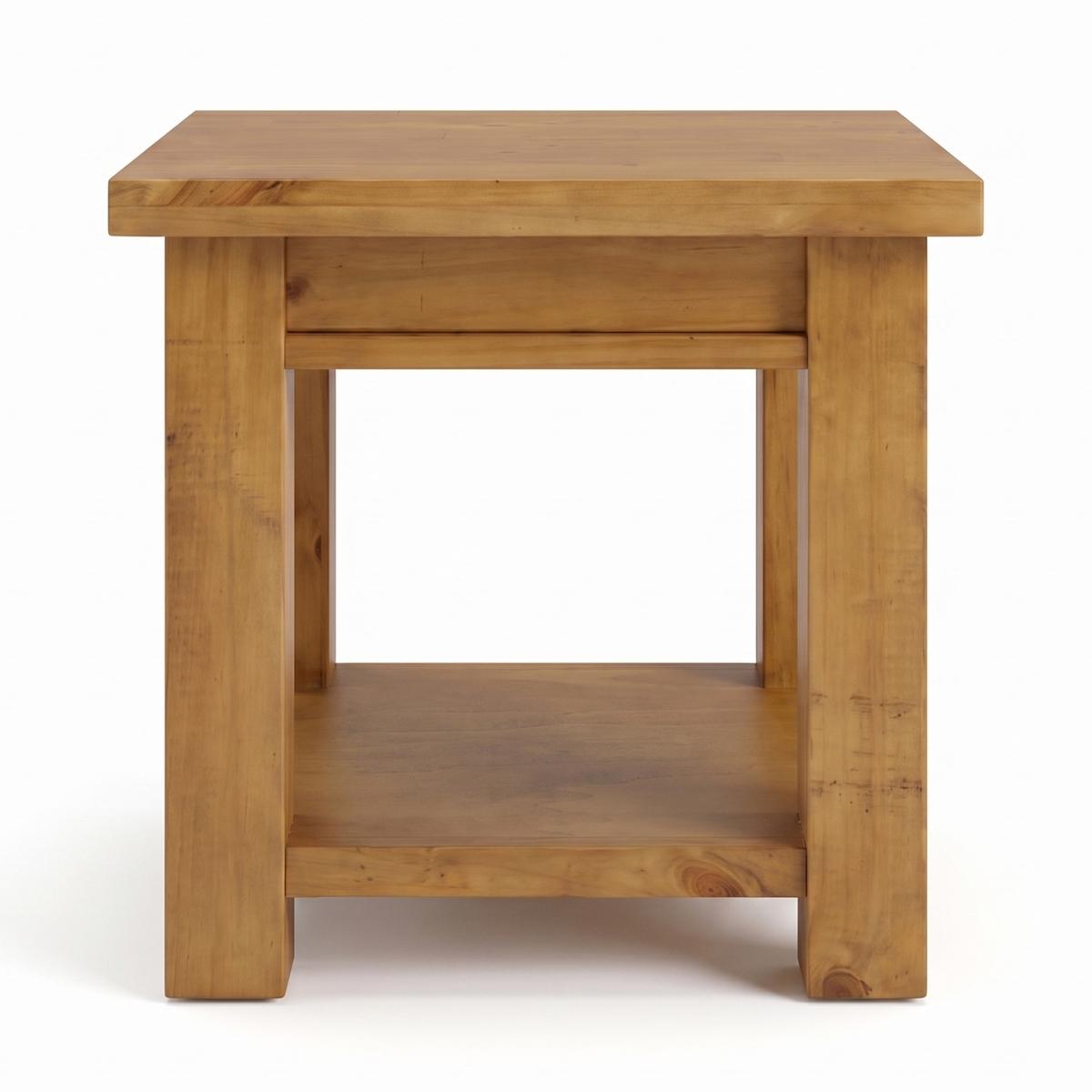 Ailbhe rustic oak side table with a warm honey finish, featuring an open lower shelf, and thick blocky legs, shown against a plain white background.