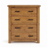 Ailbhe four-drawer rustic oak chest of drawers with a warm honey-toned finish and black metal drawer pulls, shown against a plain white background.