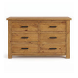 Ailbhe six-drawer wooden dresser with a rustic oak finish and black metal bar handles, shown against a plain white background.