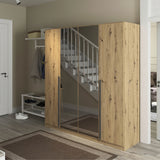 Archie oak wardrobe with glass panels in a room with a staircase and shoes on the floor.