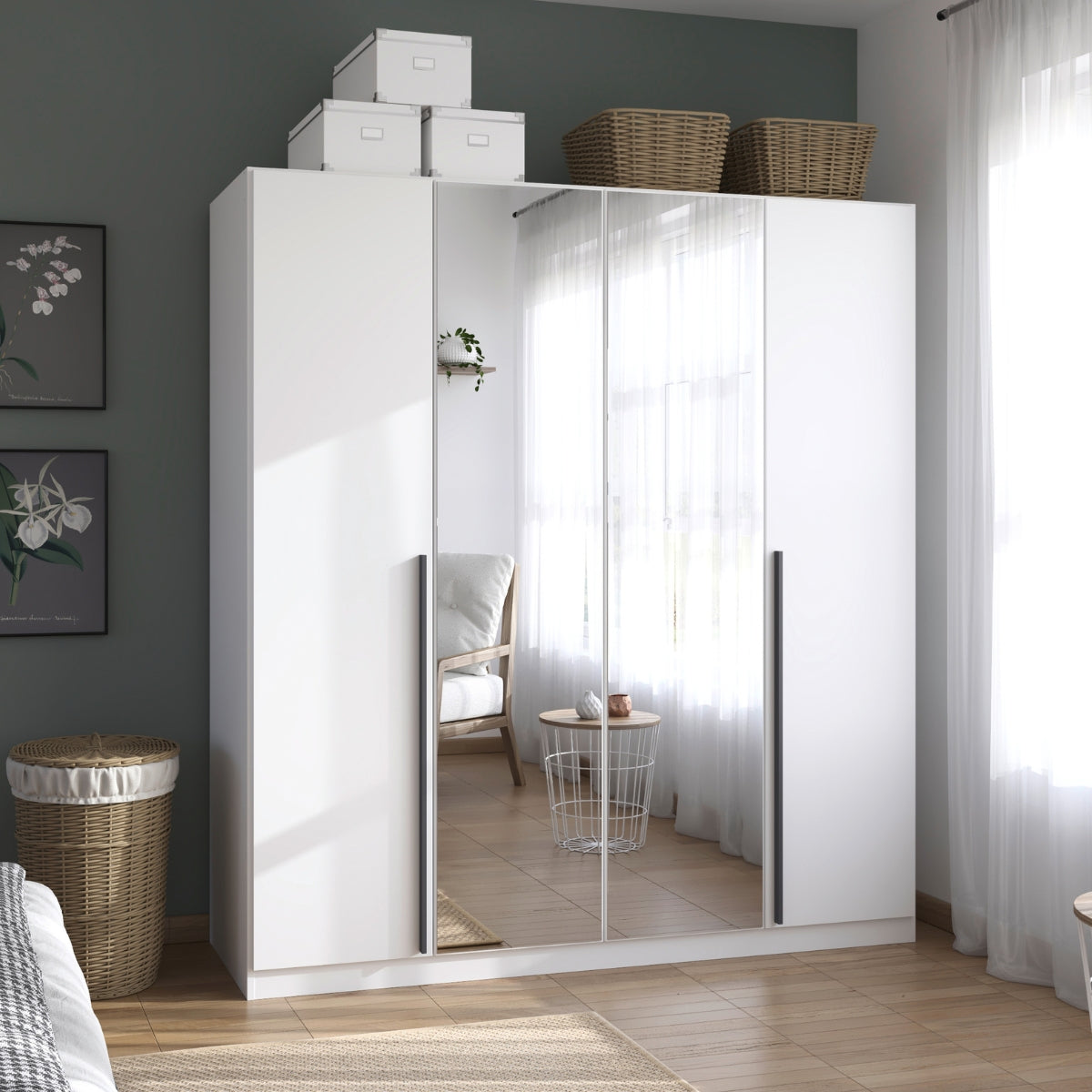 Archie white wardrobe with mirror in a room with wicker baskets and framed pictures on the wall.