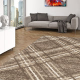 Living room with a plaid patterned rug, gray sofa, and cityscape view.