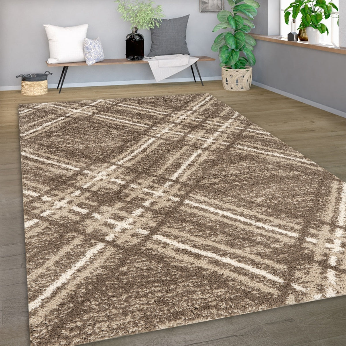 Patterned area rug on a wooden floor with a living room setting in the background.