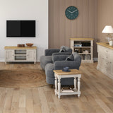 Living room with grey sofa, wooden coffee table, and striped wallpaper.