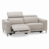 Cassara light grey leather sofa with reclining feature on a white background.