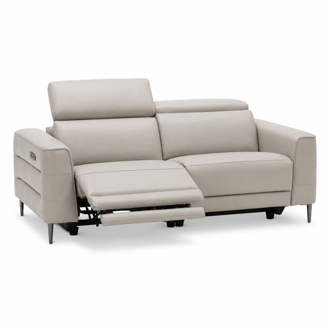 Cassara light grey leather sofa with reclining feature on a white background.