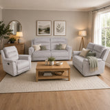 Living room with the Coolea grey sofa set, wooden coffee table, and decorative elements.