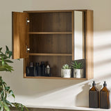 Hampshire wooden cabinet with open door displaying bottles and plants on a neutral wall.