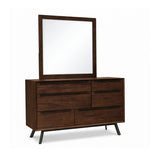 Wooden dresser with mirror on a white background
