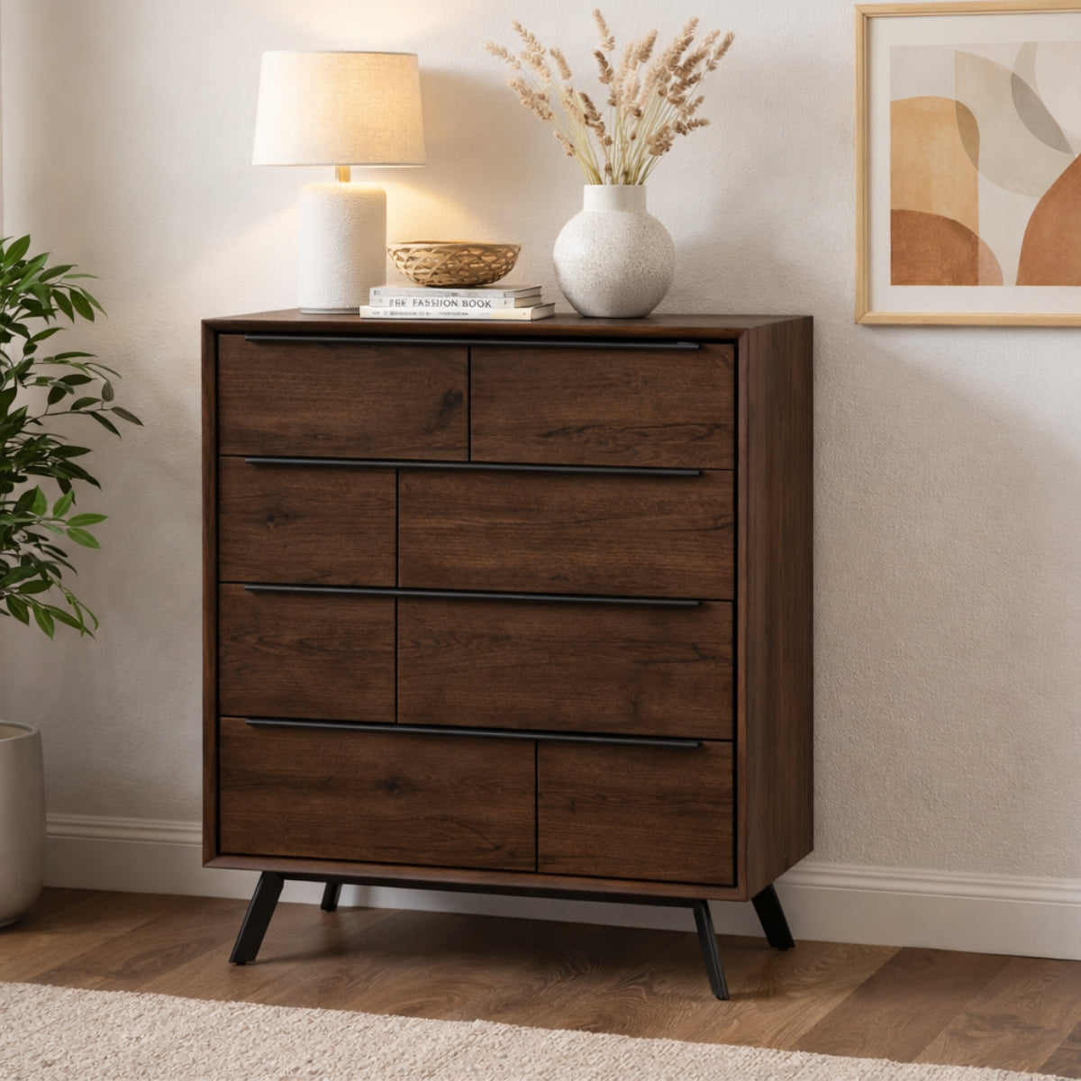 Wooden chest of drawer with decorative items in a room setting