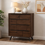 Wooden chest of drawer with decorative items in a room setting