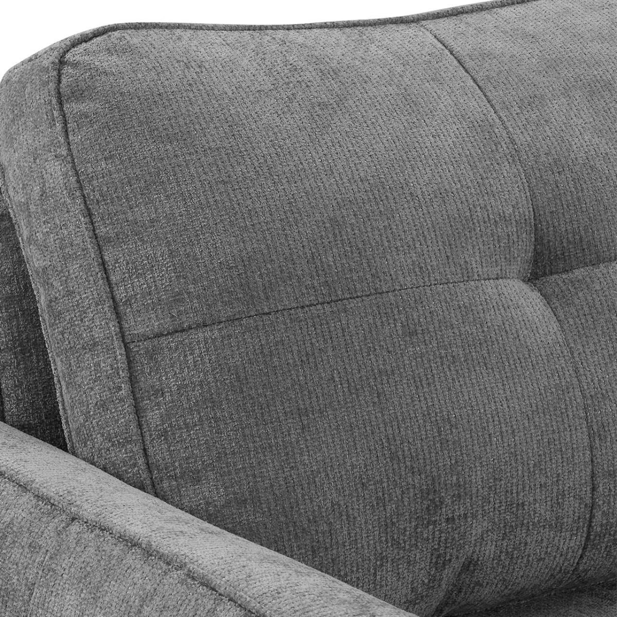 Close-up of the Keenan grey textured fabric sofa bed cushion with tufted paneling and stitched seams.