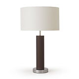Table lamp with a white shade and brown cylindrical base on a white background