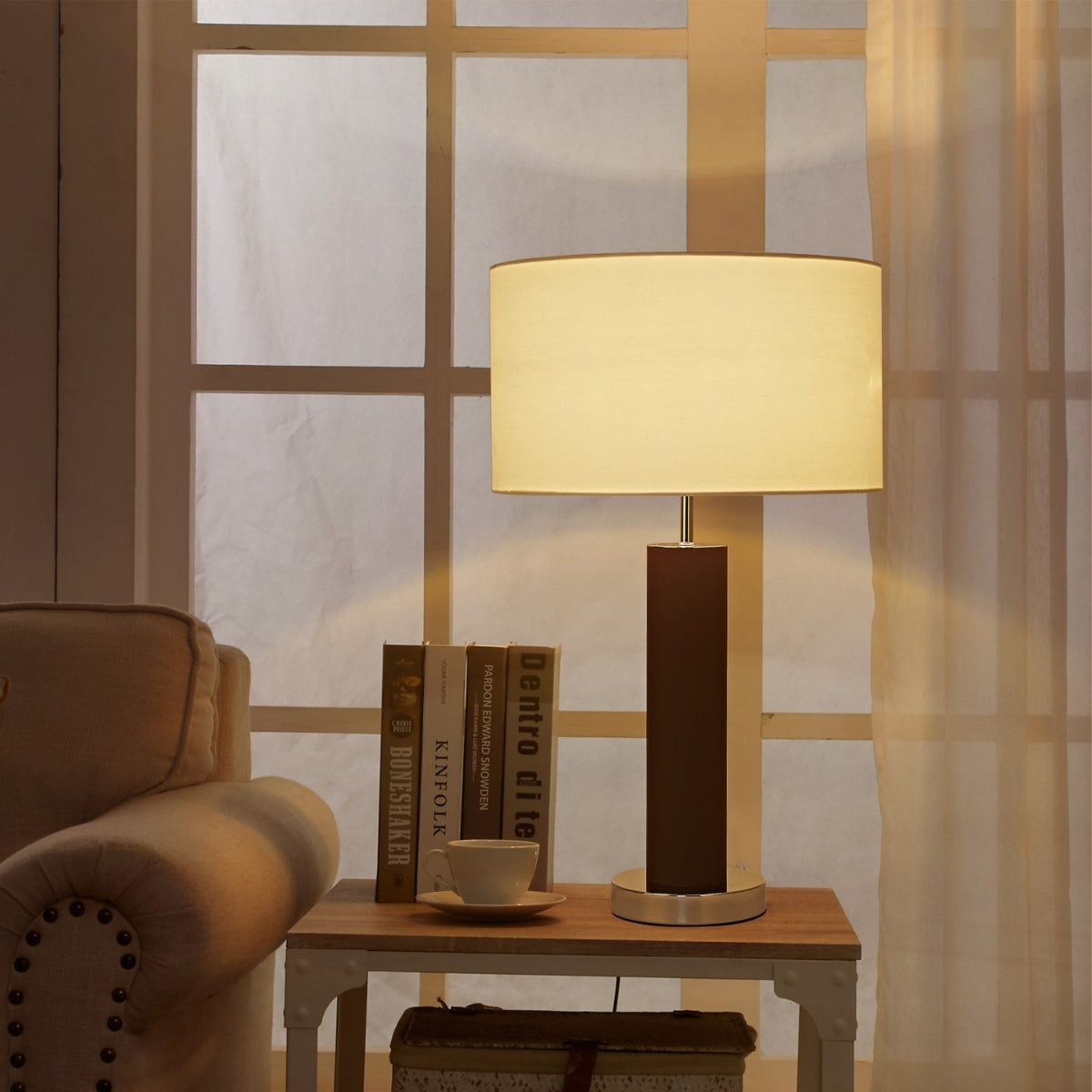 Table lamp on a side table with a cozy living room setting