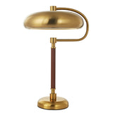 Gold desk lamp with adjustable arm on a white background