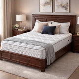 Bedroom with a wooden bed frame, white mattress, and decorative pillows.