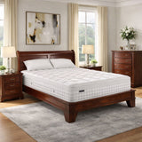 Bedroom with a wooden bed frame and white mattress, side tables, and a dresser.