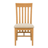 Maldon wooden dining chair with a slatted backrest and a light beige upholstered seat cushion, shown against a plain white background.