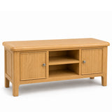 Maldon oak wood TV stand or media console with two cabinet doors, a central open shelf, and small silver knobs, shown on a plain white background.