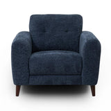 Manhattan upholstered armchair in dark blue textured fabric with tufted back cushions and tapered dark wood legs, shown on a plain white background.
