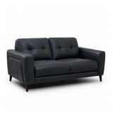 Manhattan modern 2.5 seater loveseat sofa upholstered in black leather, featuring tufted back cushions, wide armrests, and dark tapered legs, shown on a plain white background.