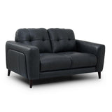 Manhattan modern two-seater loveseat sofa upholstered in black leather with tufted back cushions and dark tapered legs, shown on a plain white studio background.