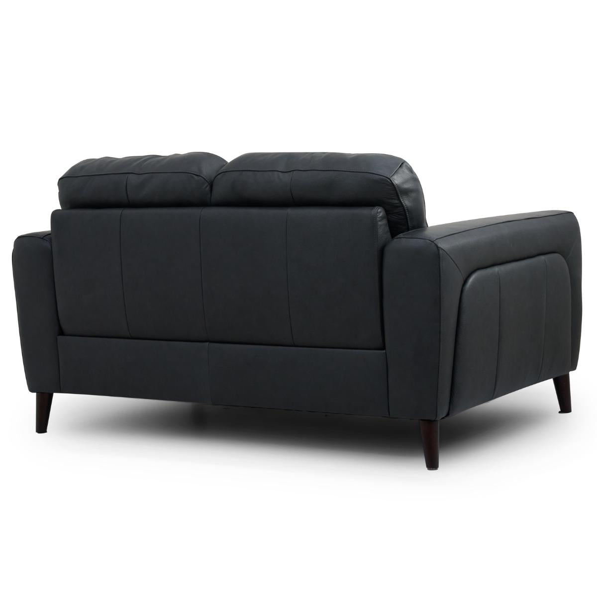 Manhattan black leather loveseat sofa shown from a three-quarter rear angle on a white studio background.