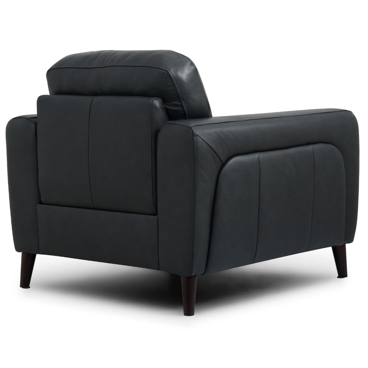 Manhattan modern black leather armchair with dark wooden legs, shown from a three-quarters angle against a plain white background.