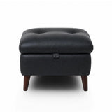 Manhattan black tufted storage ottoman with dark brown wooden legs, shown from a front-facing perspective on a white background.