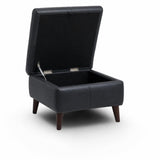 Manhattan black upholstered storage ottoman with a lift-up lid and dark wooden legs, shown open on a white background.