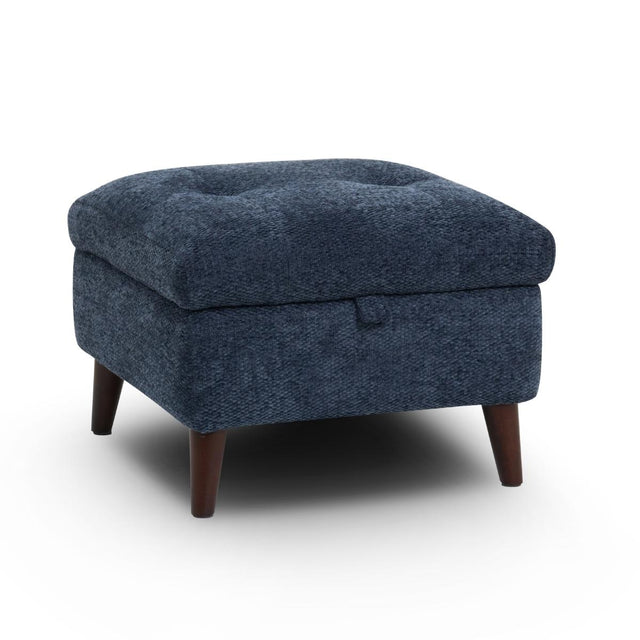Manhattan square upholstered ottoman with a tufted top cushion, dark brown wooden legs, and a textured navy blue fabric, shown on a white background.