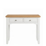 Mimosa white wooden dressing table with two drawers and a natural light wood top, featuring small round silver knobs, shown against a plain white background.