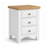 Mimosa white three-drawer nightstand with a natural wood top and round silver drawer pulls, shown on a clean white background.