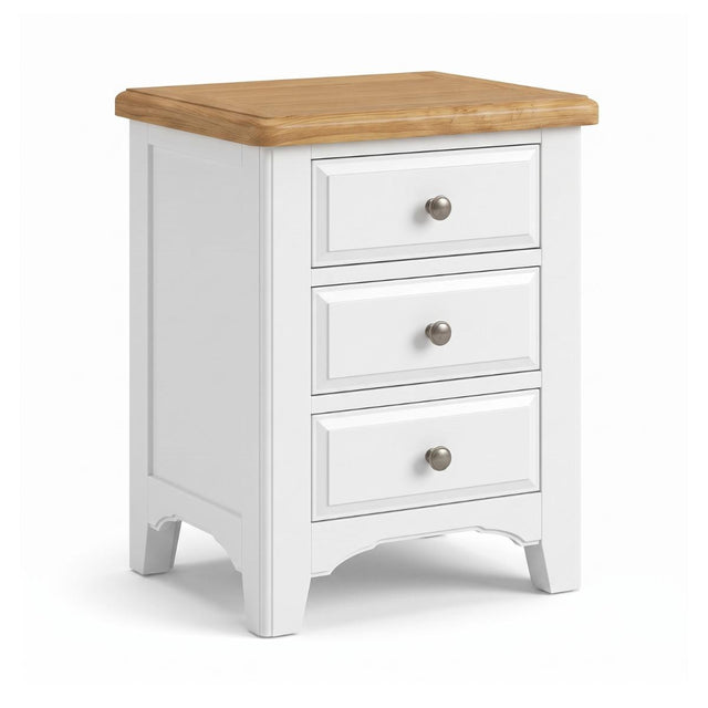 Mimosa white three-drawer nightstand with a natural wood top and round silver drawer pulls, shown on a clean white background.