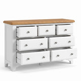 Mimosa white 7-drawer dresser with a natural oak wood top and silver round drawer knobs, shown on a clean white background.