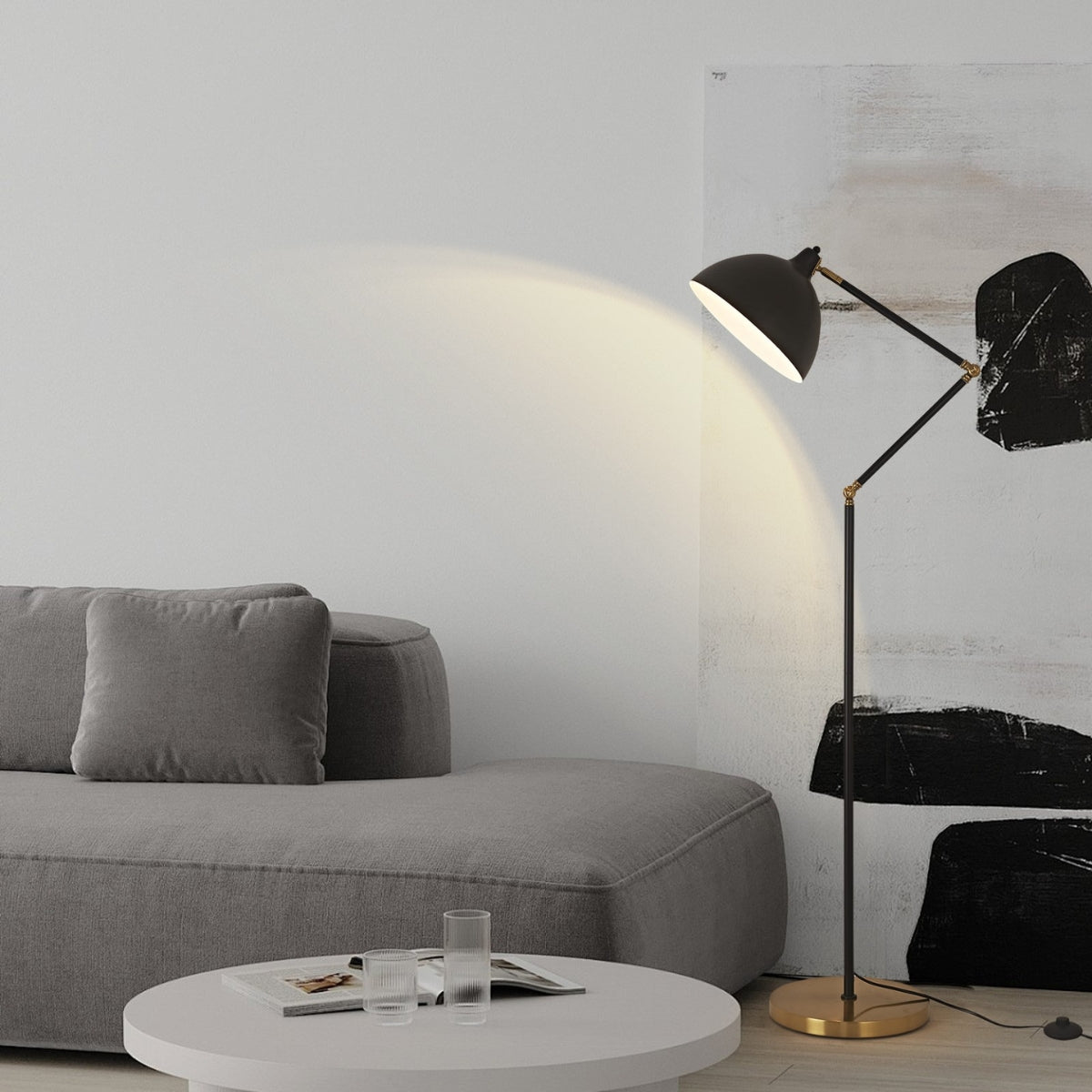 Modern living room with gray sofa, white coffee table, and black floor lamp.