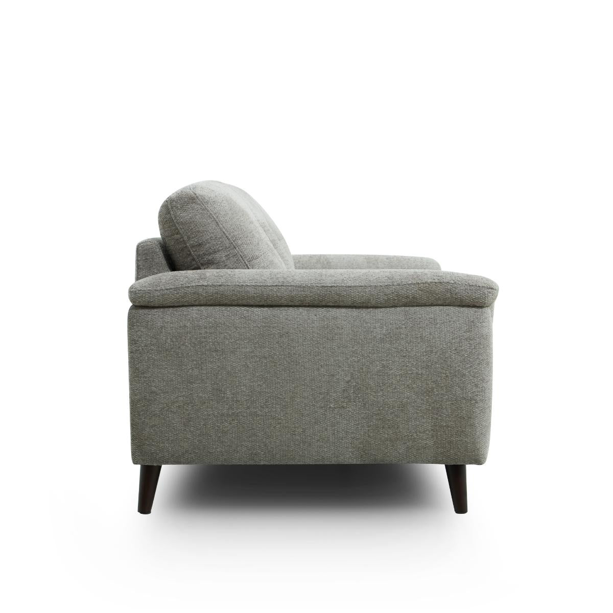 Odell grey upholstered armchair with dark tapered wooden legs, shown from a side profile view against a solid white background.