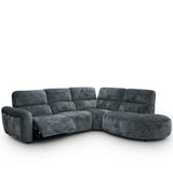Trinity charcoal plush sectional sofa with a curved chaise lounge on the right side and a reclining seat on the left, shown against a plain white background.