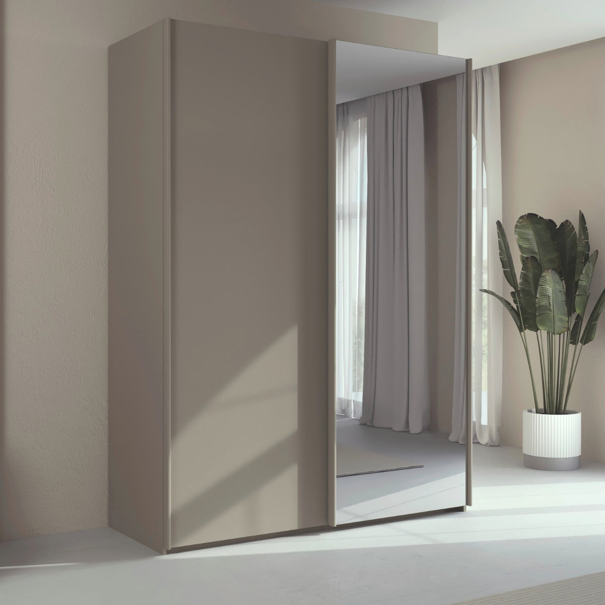 Trixie modern sliding wardrobe with mirror in a minimalistic room.
