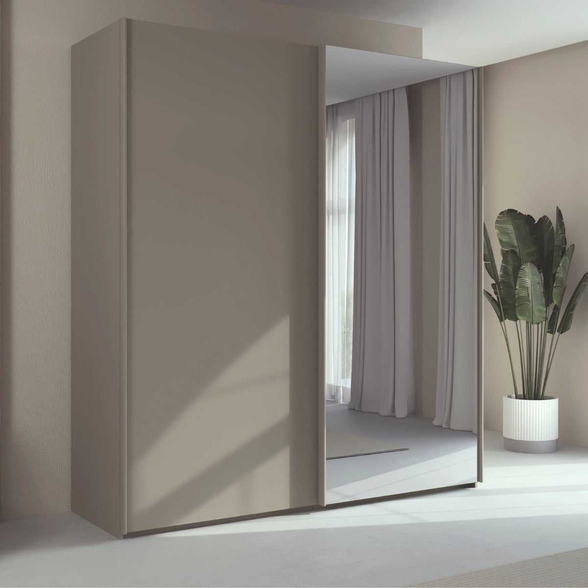 Trixie modern wardrobe with a mirror in a minimalistic room with a plant.