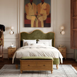 Bedroom with the vanya green upholstered bed, wooden nightstands, and abstract painting on wall.