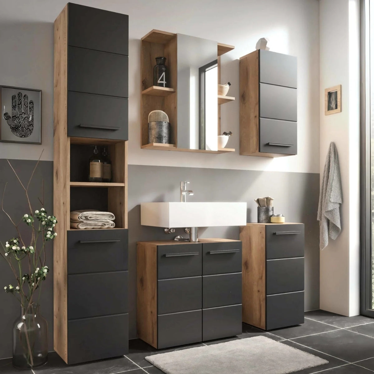 Bathroom interior with wooden and black cabinets, sink, and mirror.