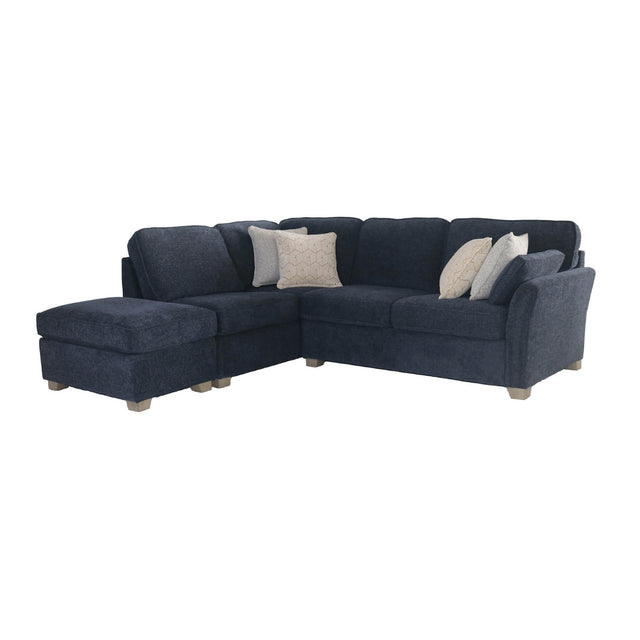 A dark navy blue sectional sofa with a left-facing chaise ottoman and four decorative throw pillows, shown against a plain white background.